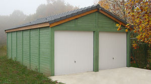 garage en béton aspect bois 2 pentes couvertures tuiles entrée en pignon avec 2 portails basculants