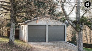 Double garage en béton aspect bois 2 pentes.