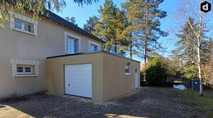 Garage en béton aspect terrasse couverture bacs acier