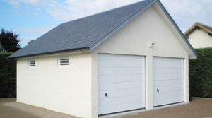 garage en béton 2 pentes couverture ardoise avec portes sectionnelles