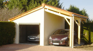 garage en béton 1 pente couverture tuiles avec 1 portail basculant et auvent accolé en façade