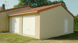 garage en béton accolé 2 pentes couverture tuiles 2 portes basculantes